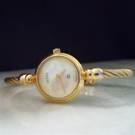 ladies gucci gold mother of pearl watch|Gucci 147.4.